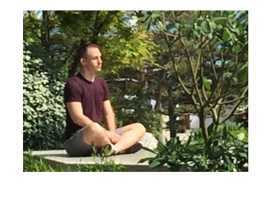 Social media photo: Justin Bonomo meditating at the Japanese Gardens in Monte Carlo.  Spring of 2018.